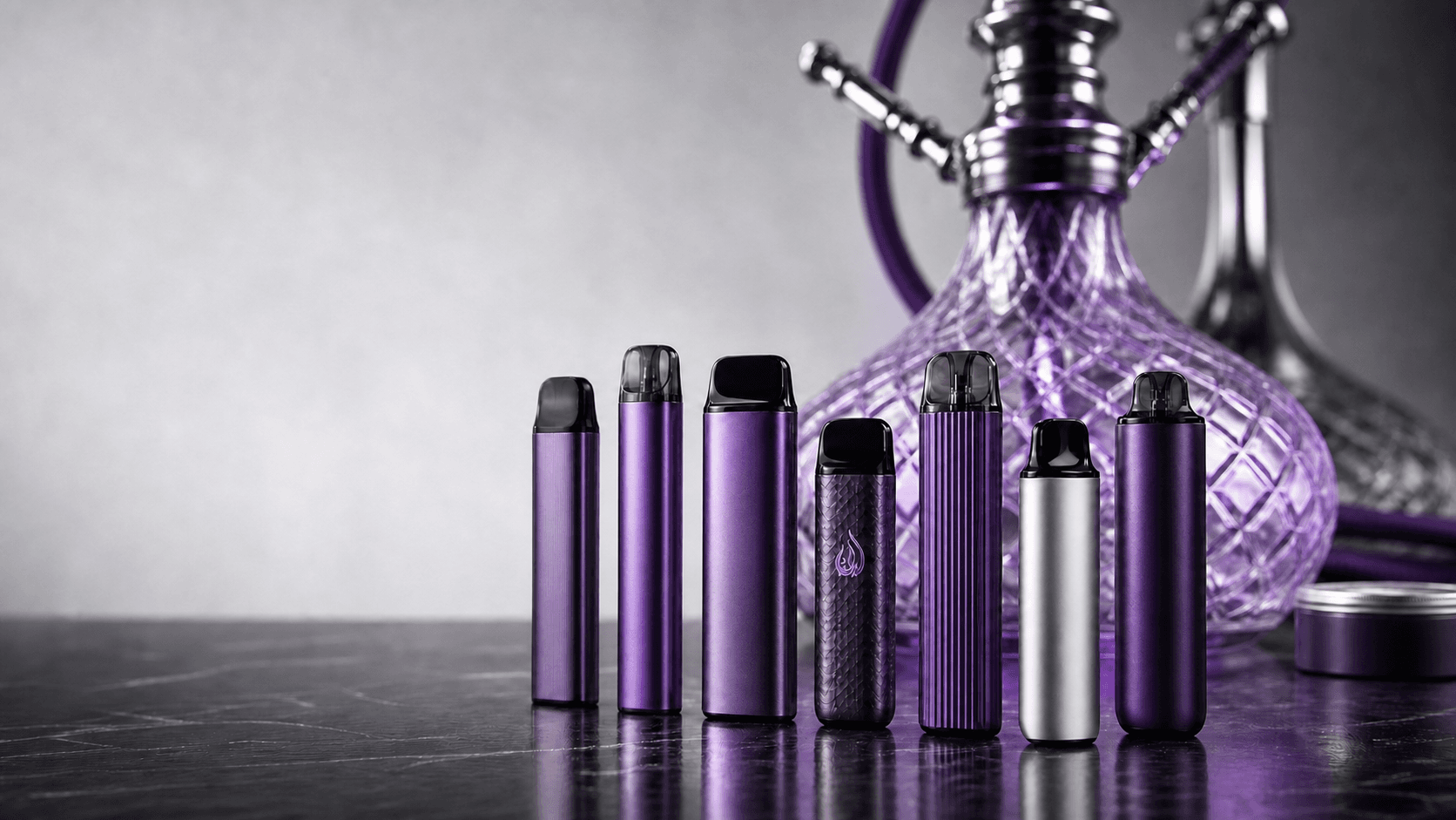 Purple vape devices displayed in front of a glass hookah
